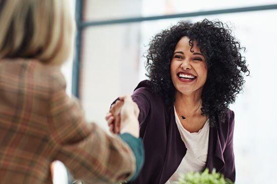woman-handshake-happy_gettyimages-642501464